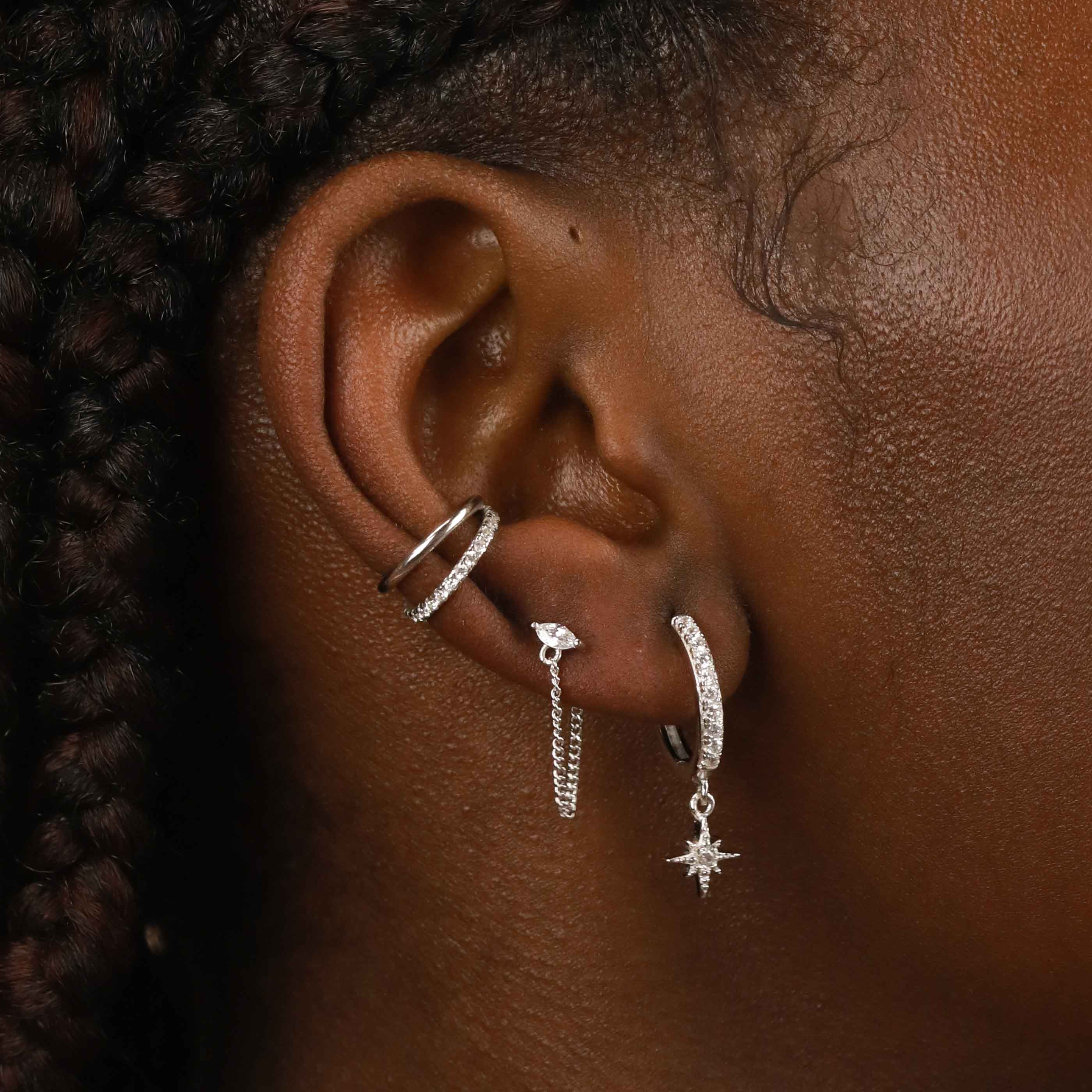 Crystal Star Hoops in Silver worn with other earrings