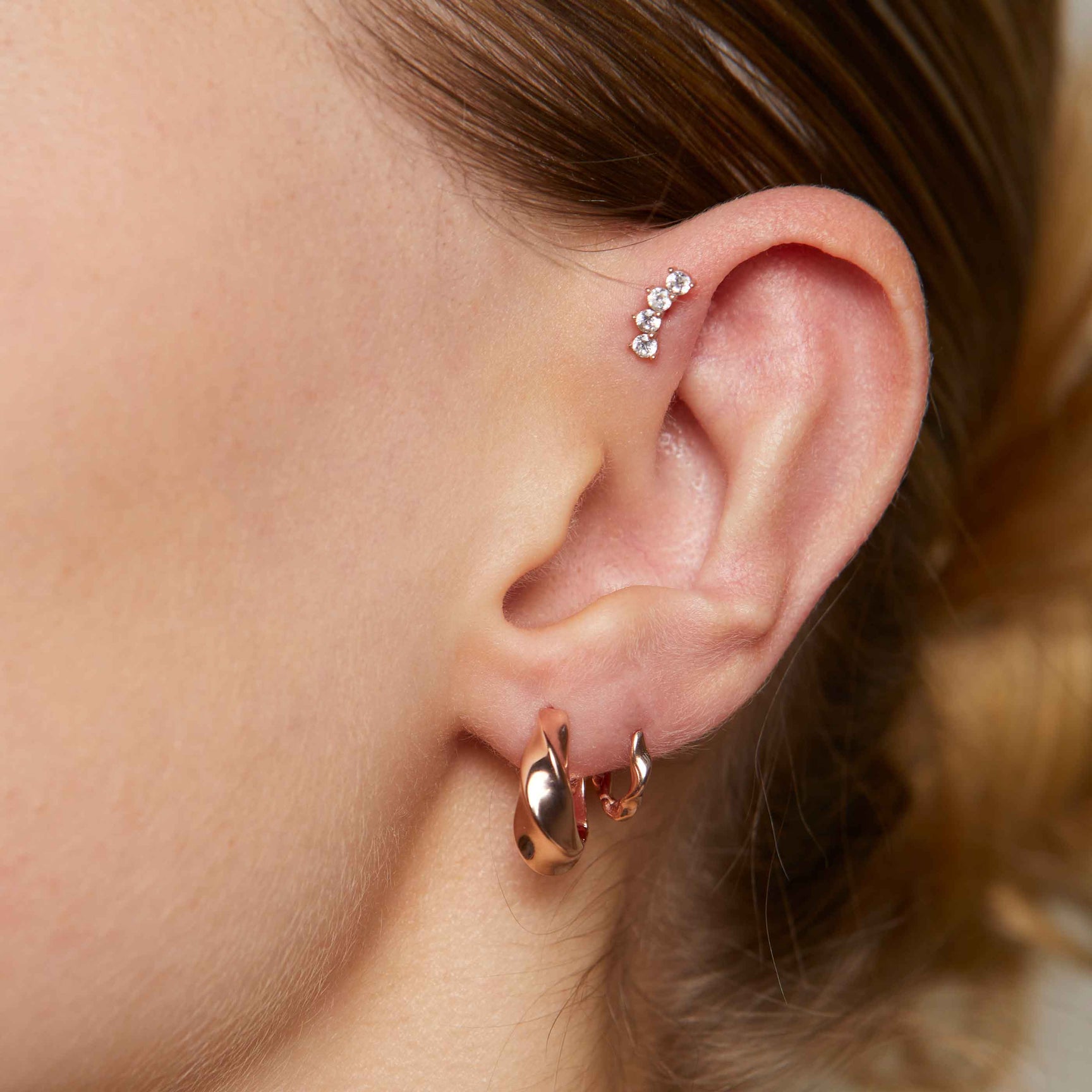 Curved Crystal Barbell in Rose Gold worn with Elemental Hoops and Elemental huggies