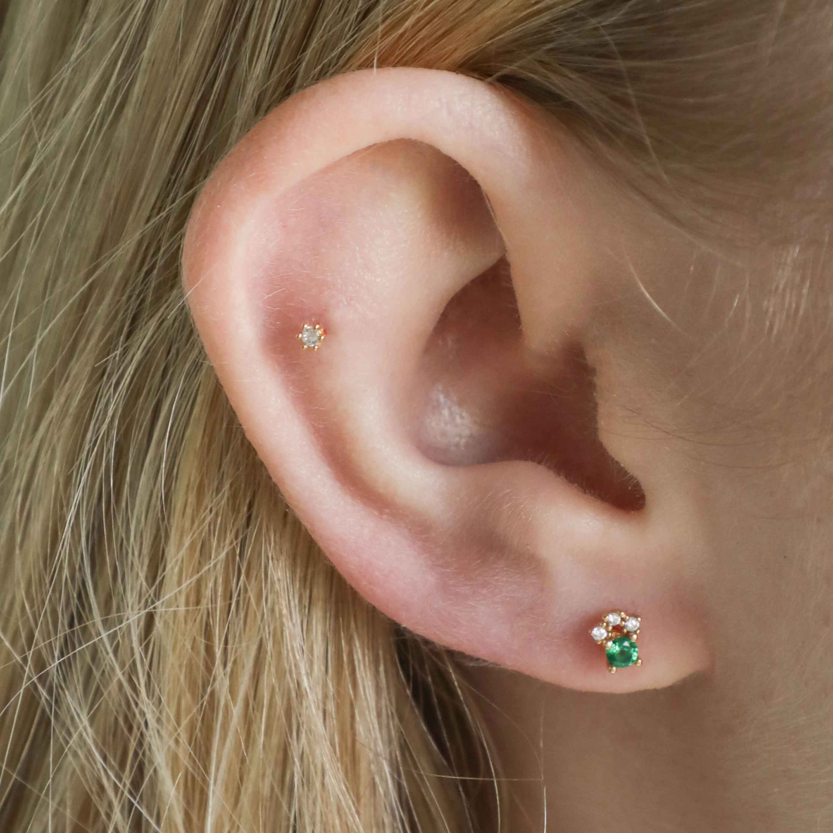 Emerald & Crystal Barbell in Gold worn in first lobe piercing