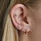 Emerald & Crystal Barbell in Gold worn in outer conch piercing