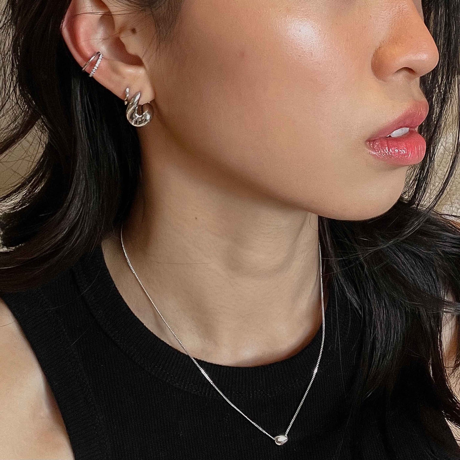Molten Hoops in Silver worn with elemental huggies and illusion crystal ear cuff