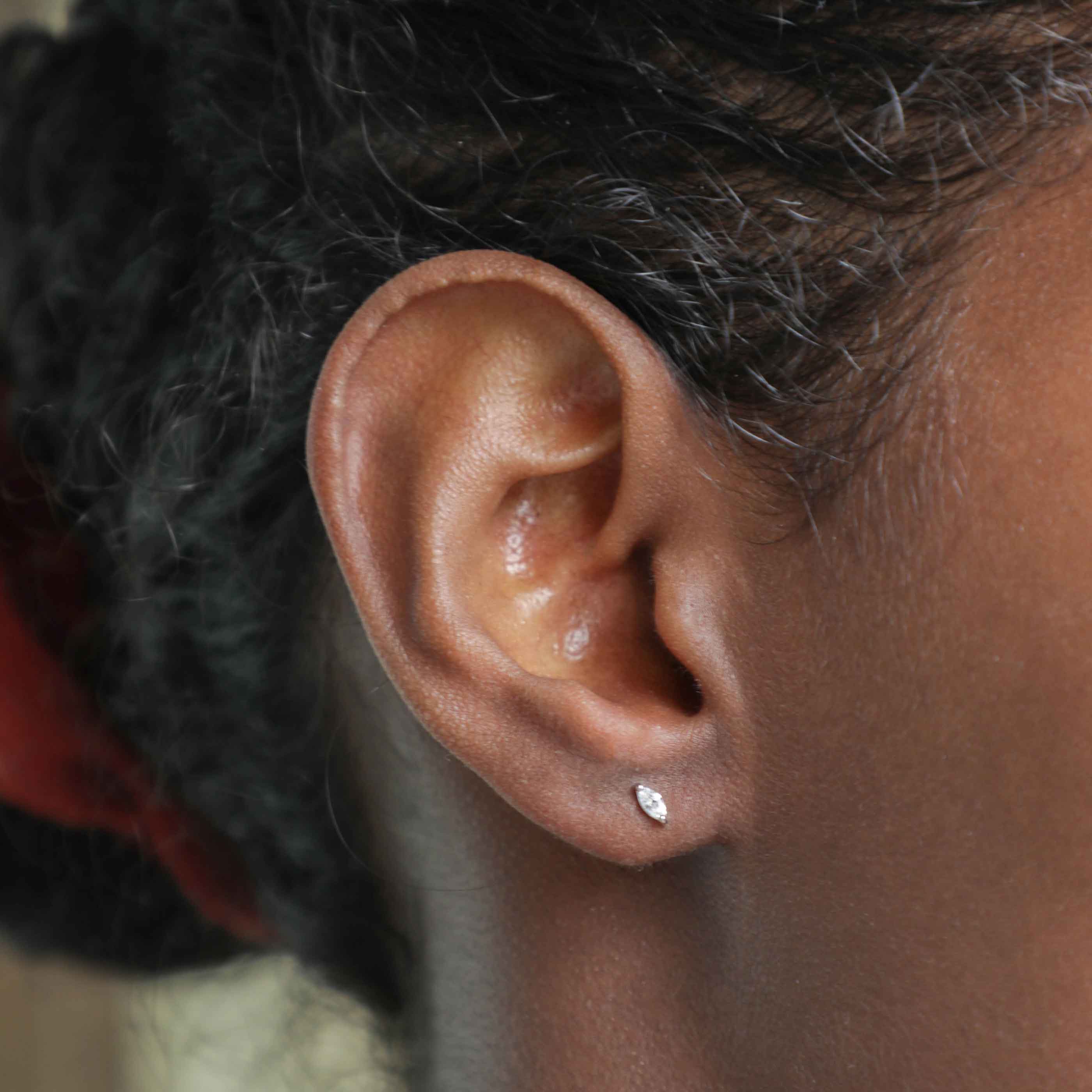 Navette Stud Earrings in Silver worn in first lobe piercing