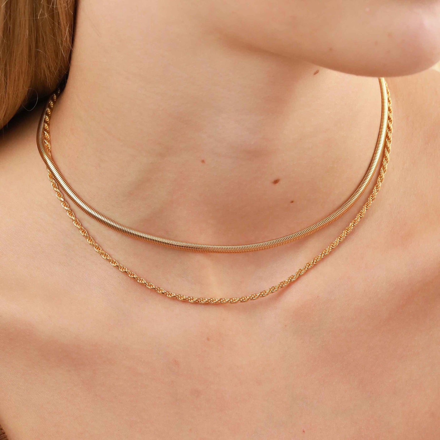 Oval Snake Chain Necklace in Gold worn with bold rope chain necklace