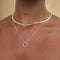 Silver snake chain worn with dainty pendant necklace